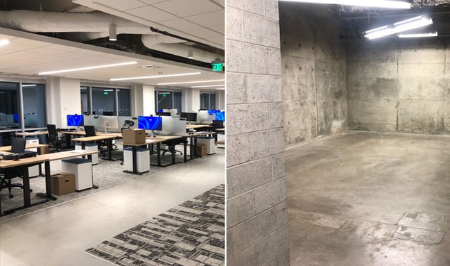 Open office space with desks, computer workstations, and an empty, clean storage area.
